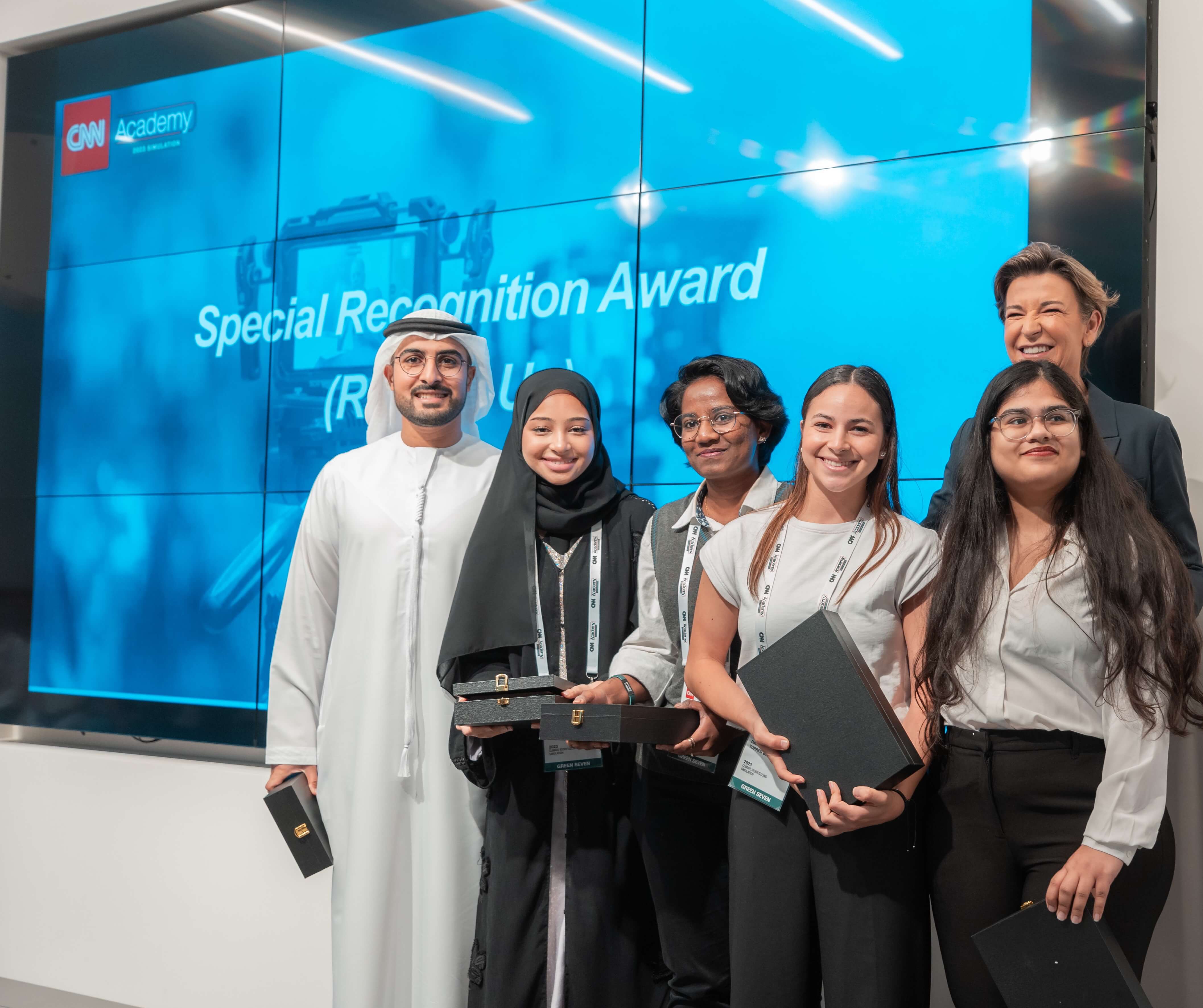 CNN's Becky Anderson with the winners of the 2023 CNN Academy Climate Storytelling Simulation: Abdulrahman Al Marzooqi, Alia Al Zaabi, Lhekkah Sivaraja, Esha Mitra, Daniela Torres Basila